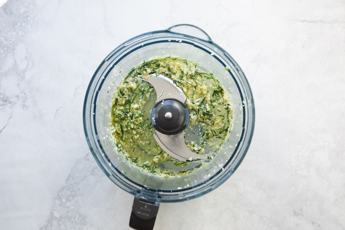 Seasonings for roast rack of lamb in a food proecssor.