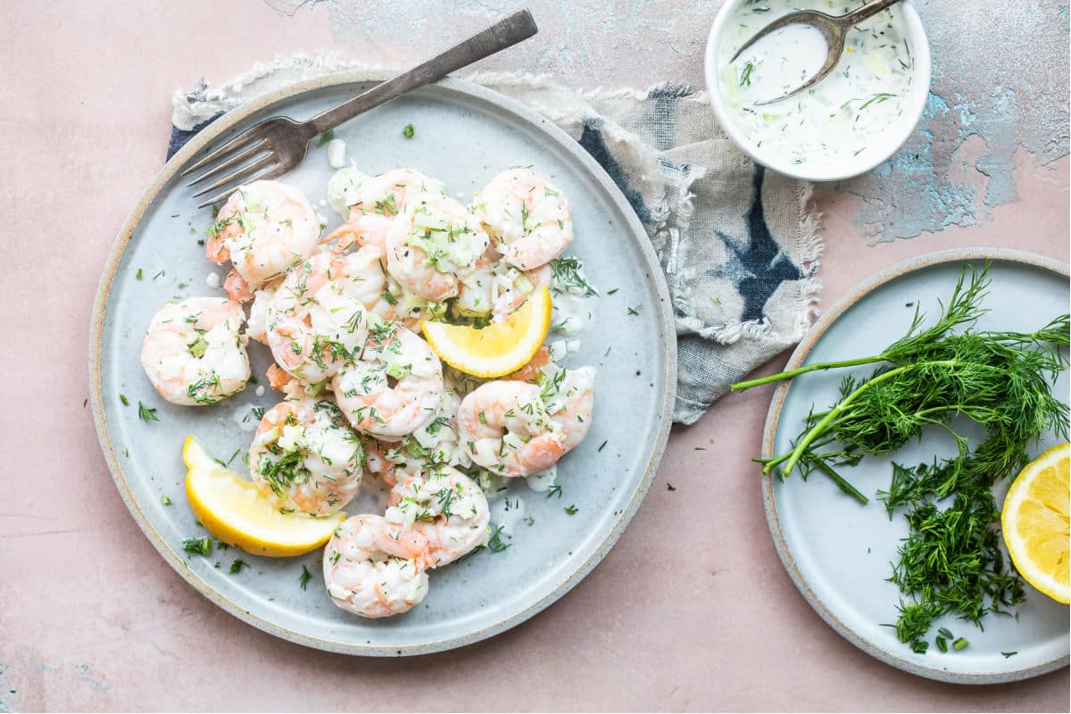 Shrimp salad on a blue plate.
