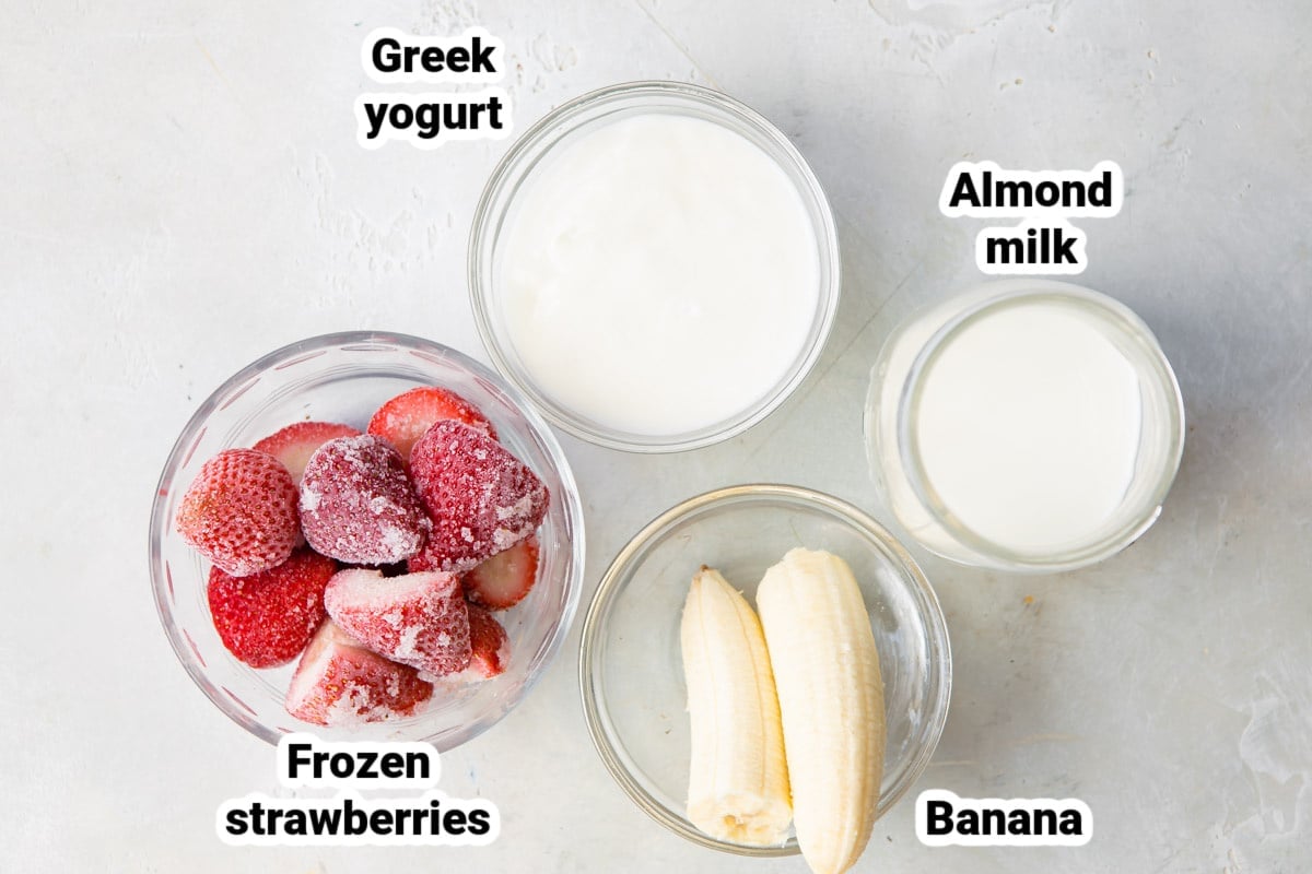 Labeled ingredients for a strawberry banana smoothie.