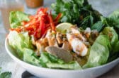 A Thai Chicken Salad in a white bowl.