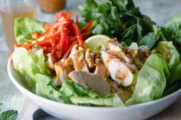 A Thai Chicken Salad in a white bowl.