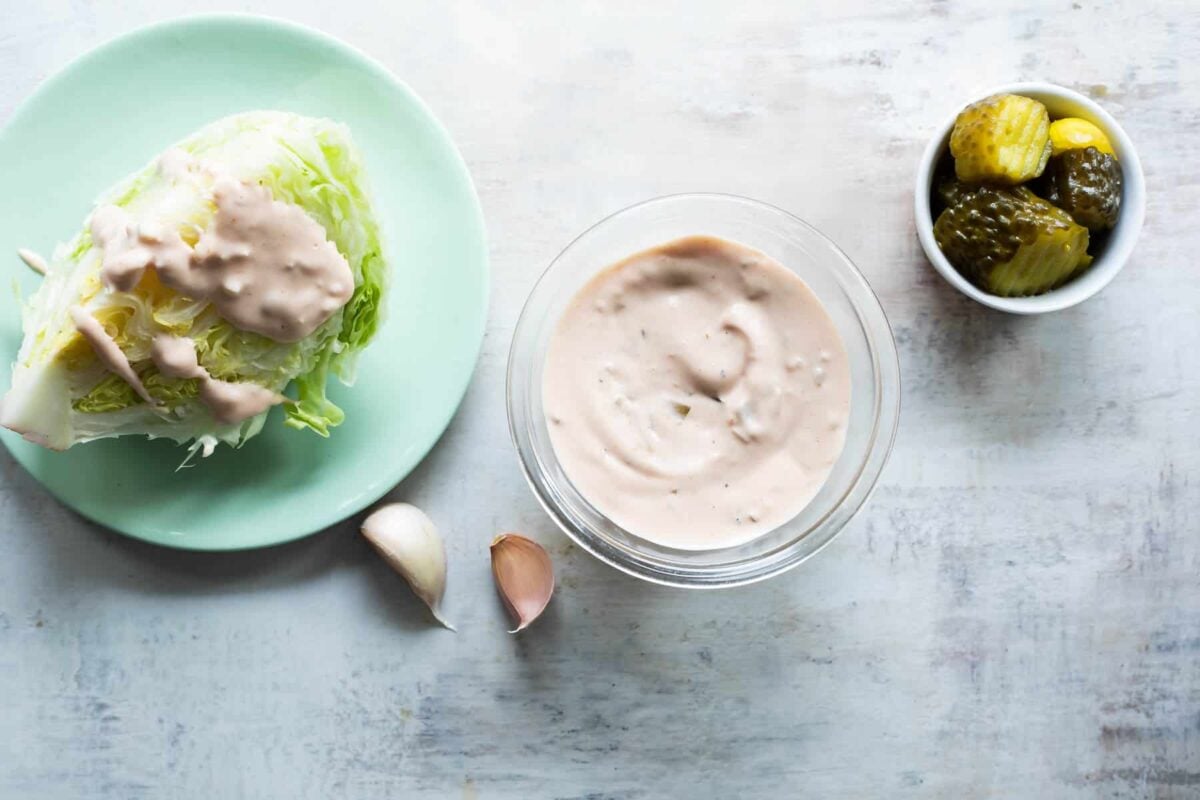 Thousand Island dressing in a clear bowl on a countertop.