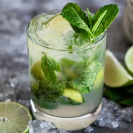 A virgin mojito mocktail in a clear glass.