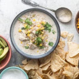 Slow cooker white turkey chili in a blue bowl.