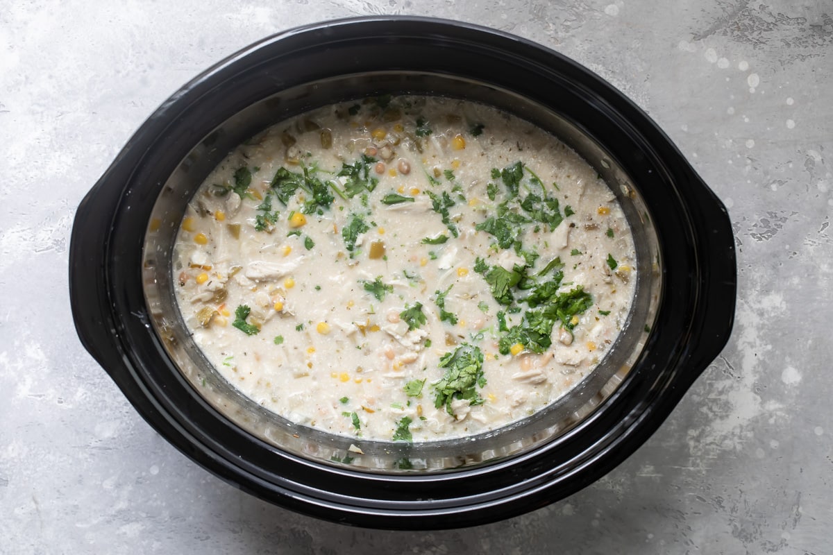 A crockpot full of white turkey chili.