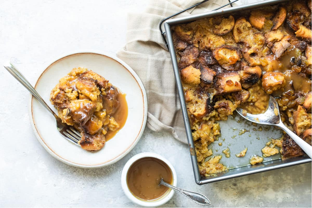 A plate of bread pudding with a fork resting on it.