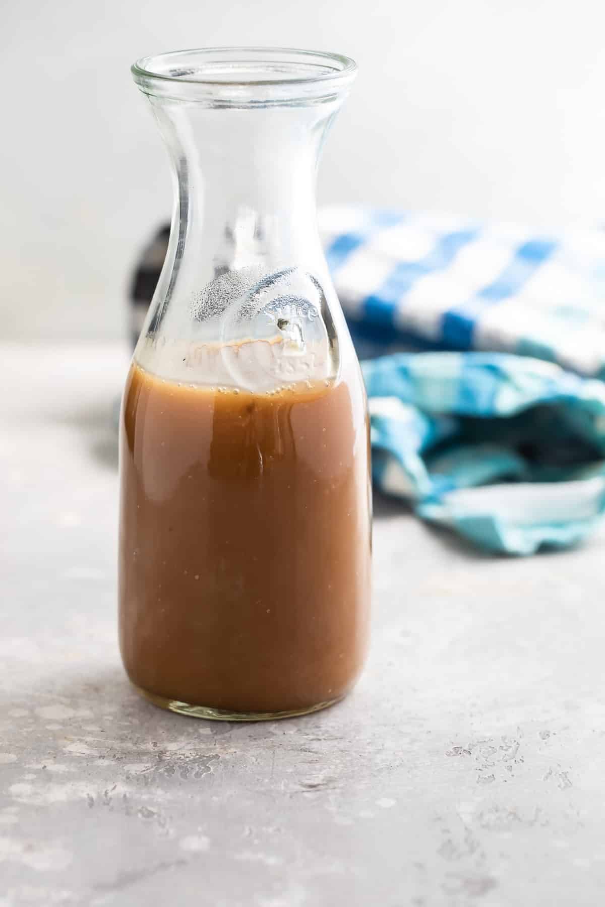 Caramel sauce in a carafe.