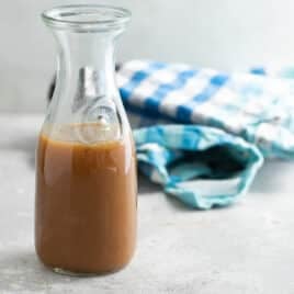 Caramel sauce in a carafe.
