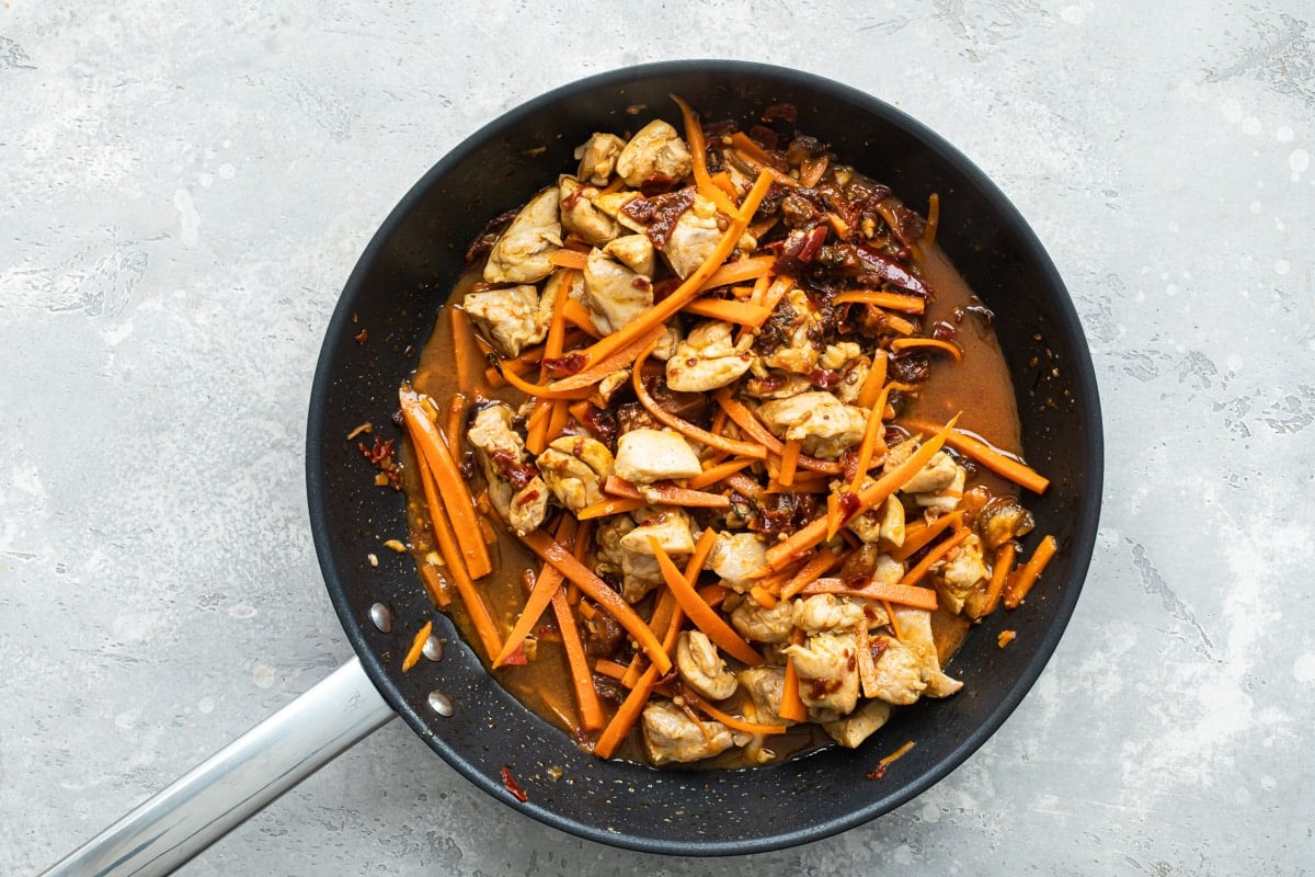 Harissa chicken in a black skillet.