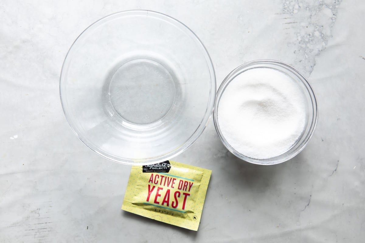 Ingredients for blooming yeast (yeast, water, and sugar).