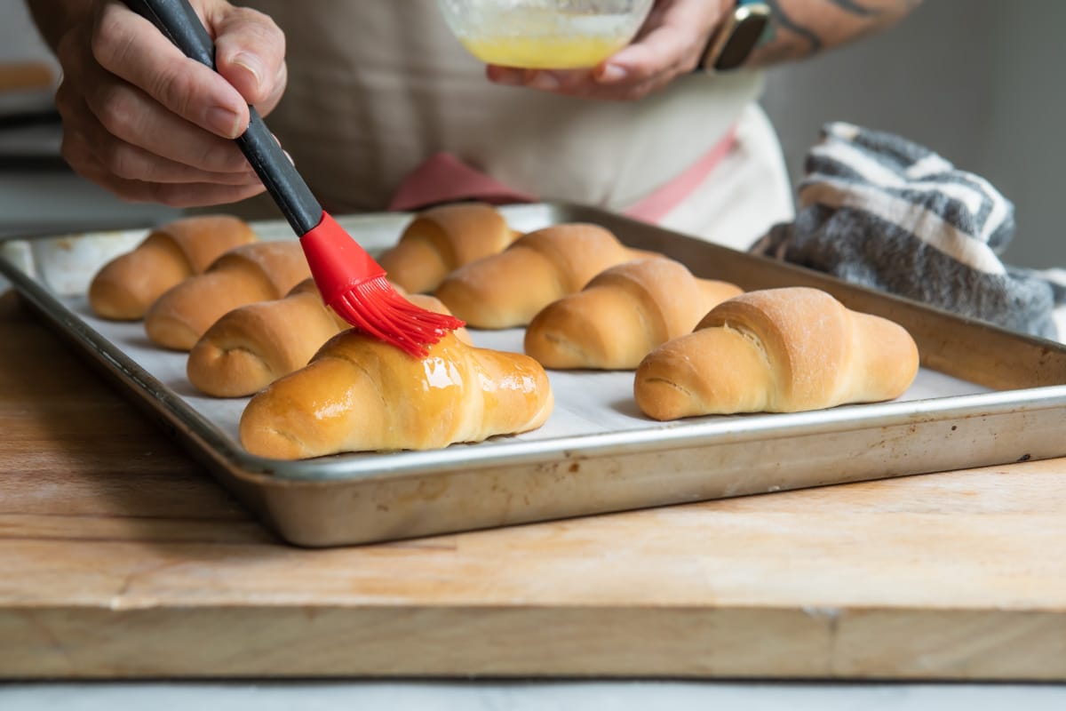 Crescent rolls on a baking sheet.