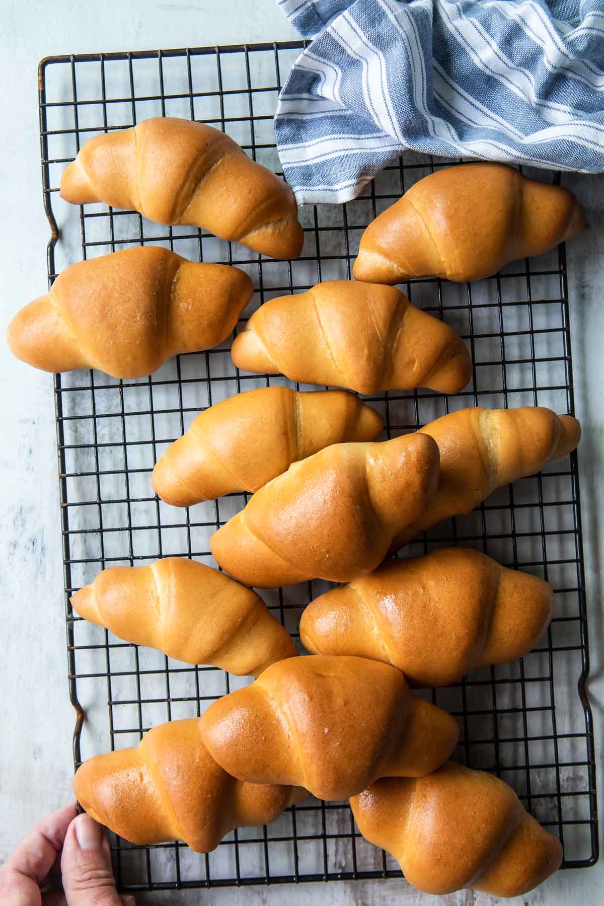 Crescent rolls on a cooling rack.