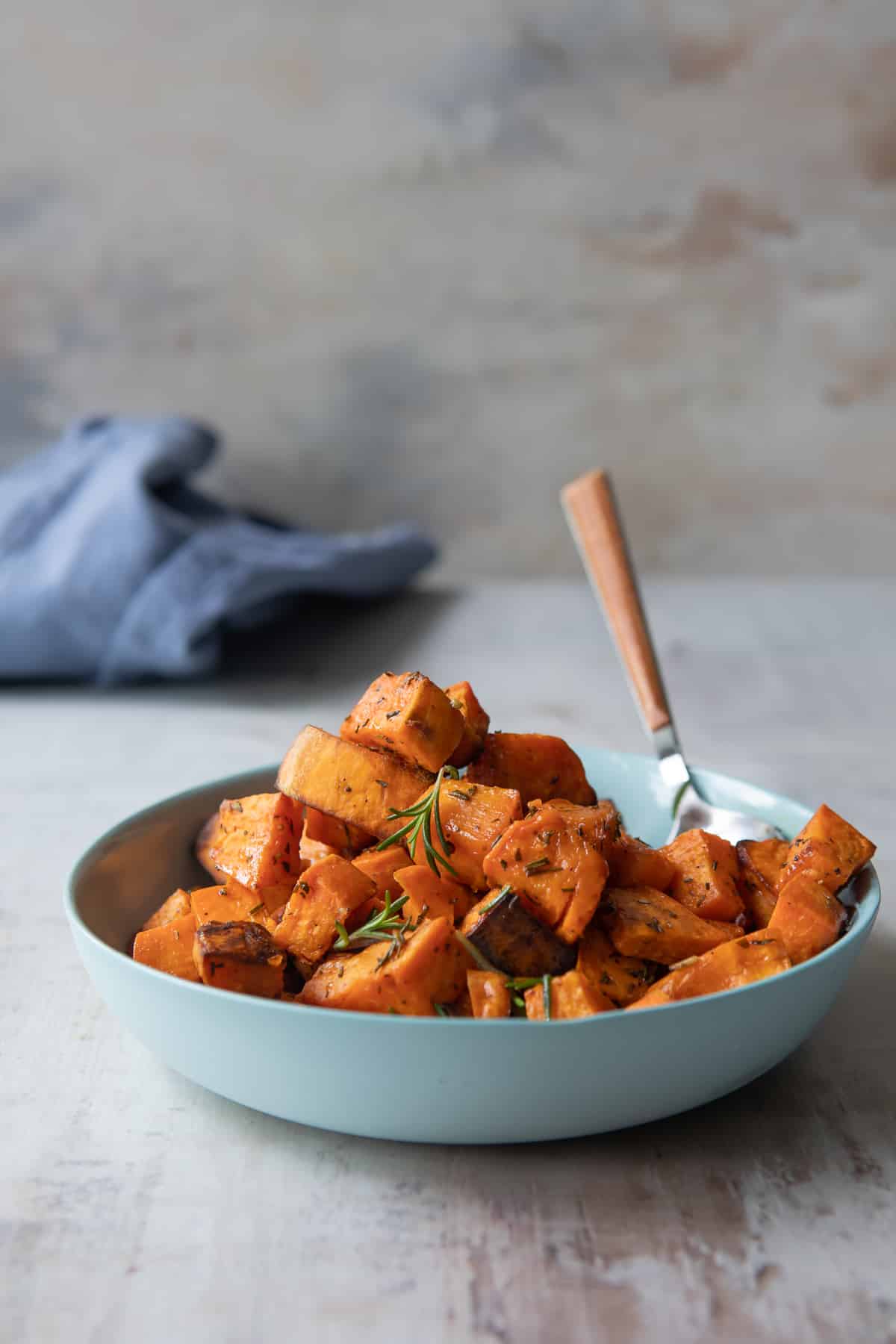 A bowl of cubed roasted sweet potatoes.