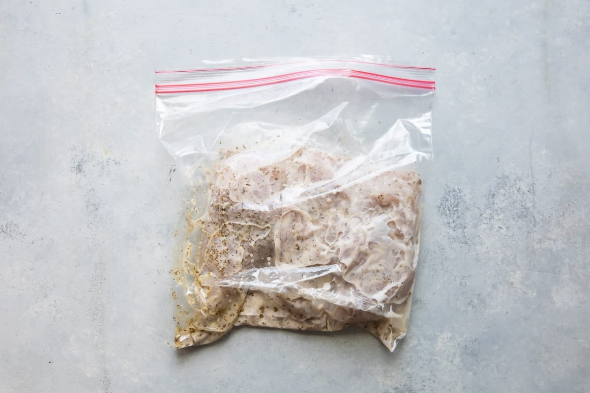 A bag of chicken in marinade.