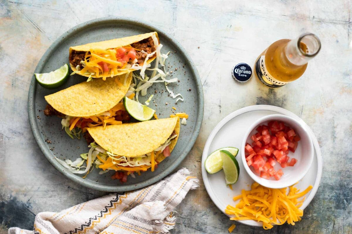 A plate of ground beef tacos.