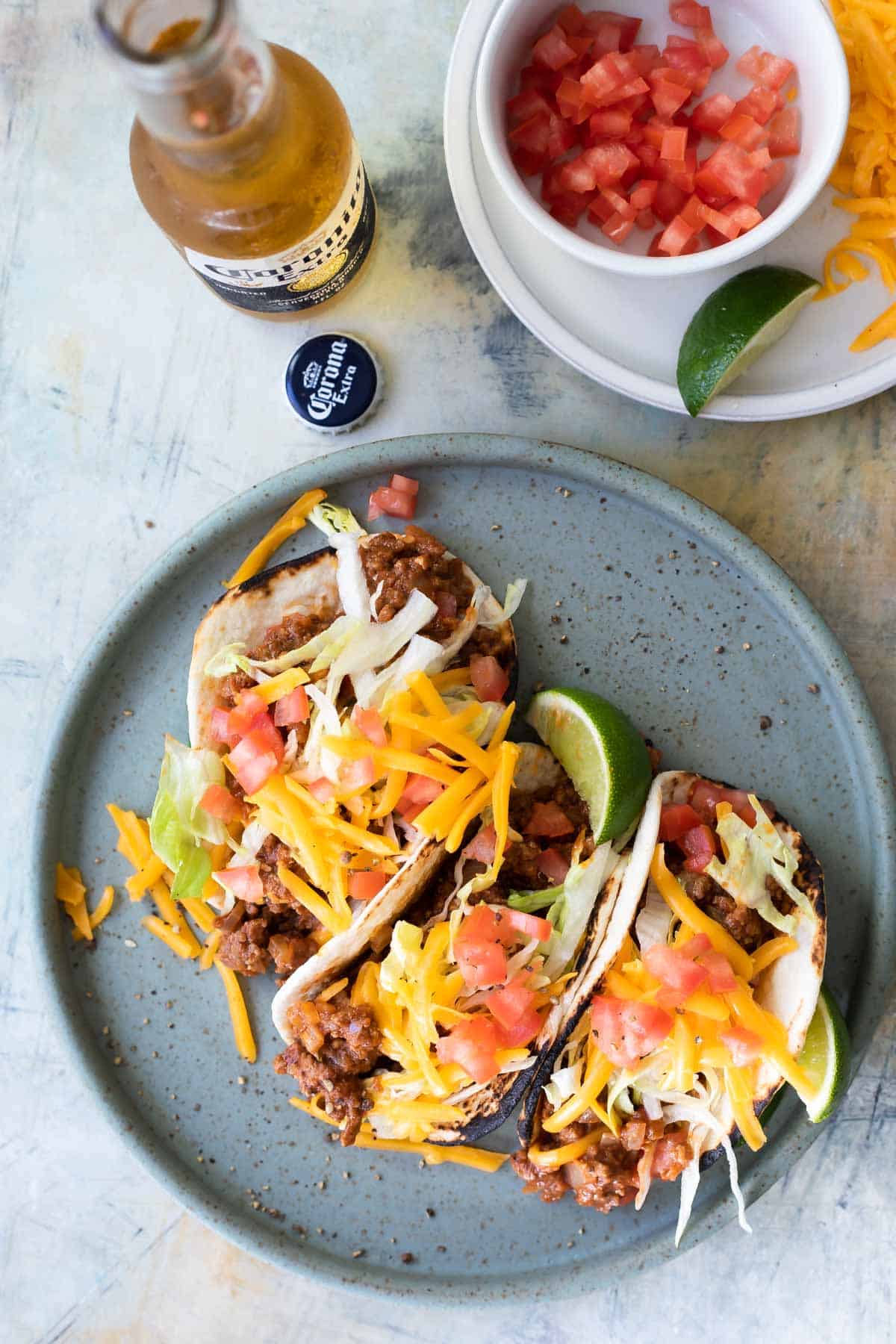 A plate of ground beef tacos.