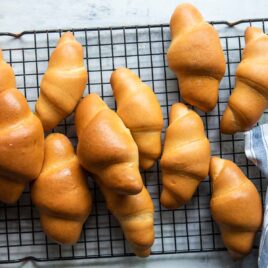 Crescent rolls on a cooling rack.