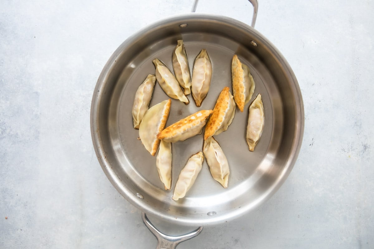 Potstickers that have been browned on the bottom in a skillet.