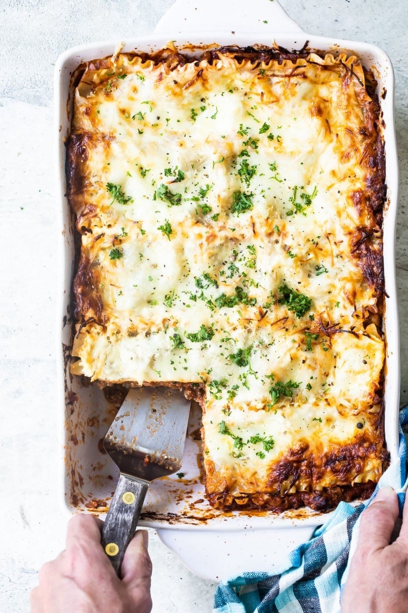 A white baking dish of lasagna.