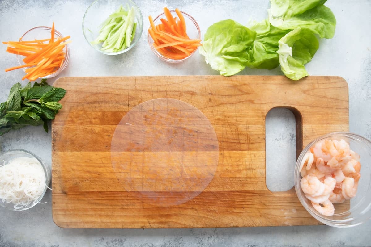 A piece of rice paper on a cutting board.