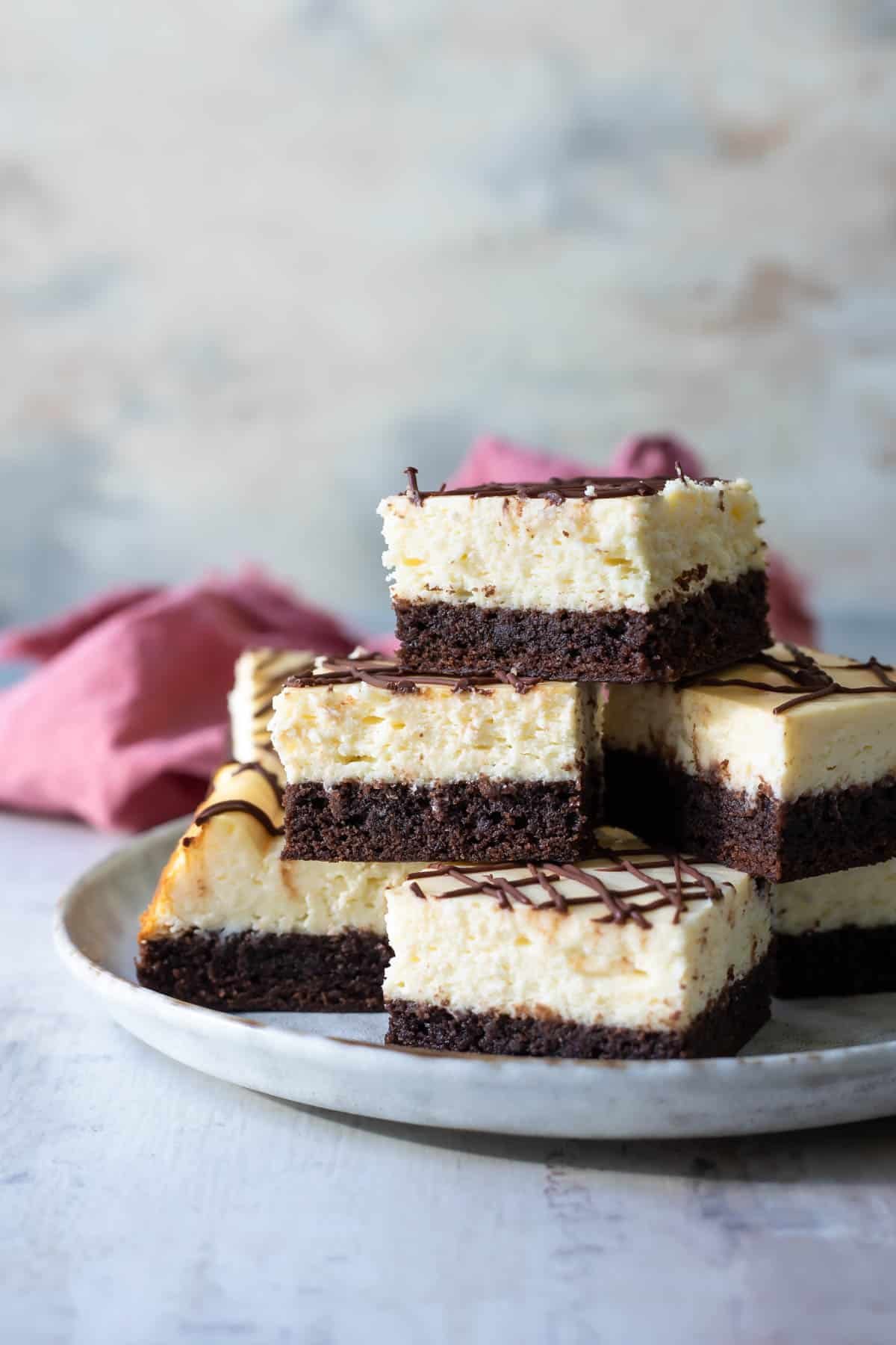 A plate of cheesecake brownies.