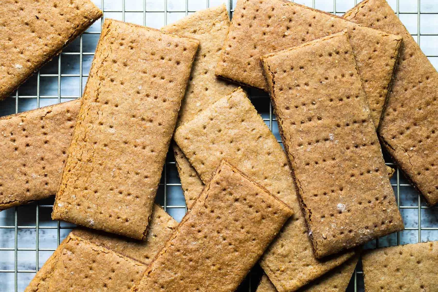 Homemade graham crackers on a cooling rack.