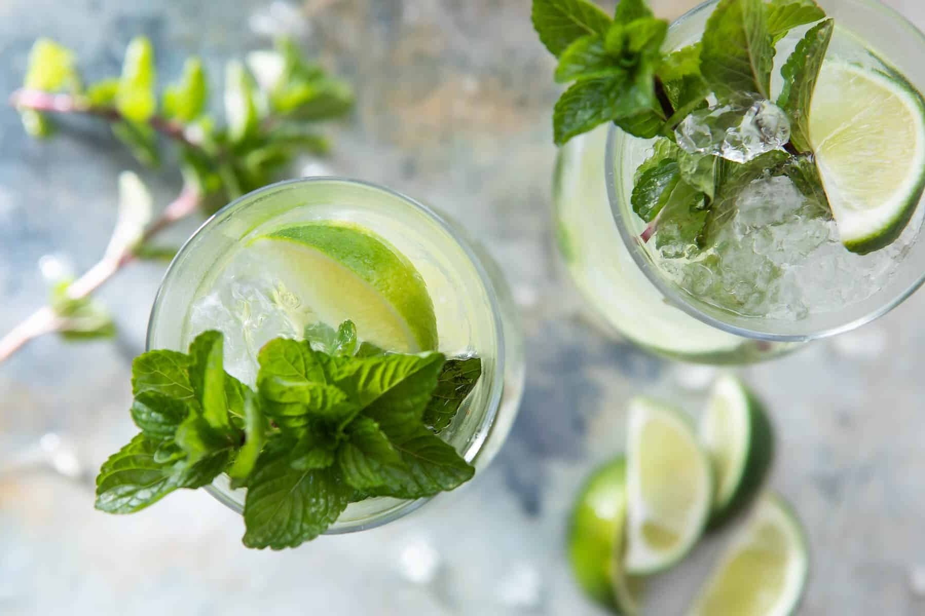 Two mojitos in glasses.