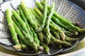 Asparagus in a steamer basket.
