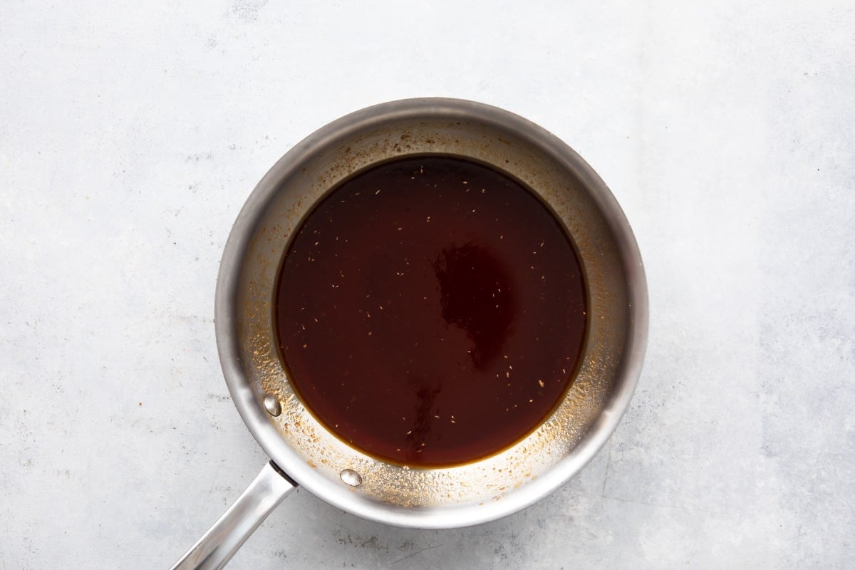 Sauce for chicken lettuce cups in a silver pan.
