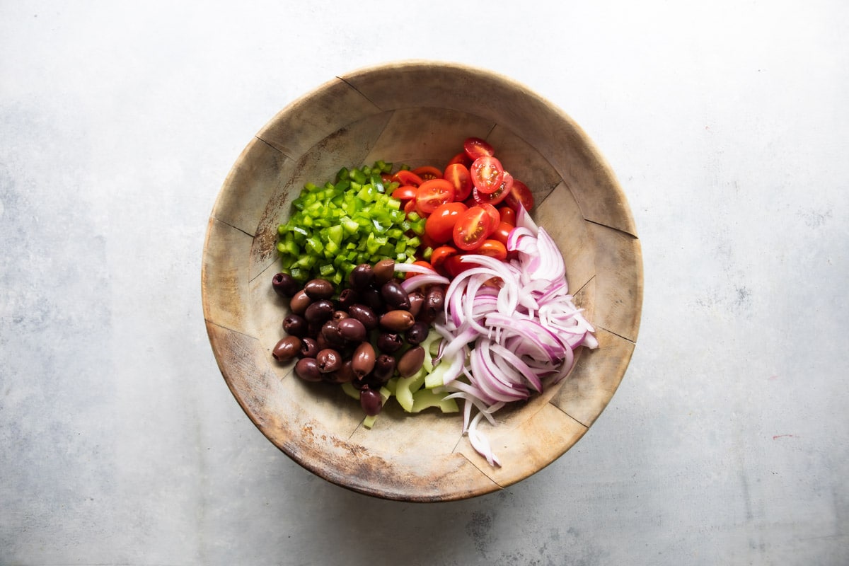A bowl of Greek salad ingredients.
