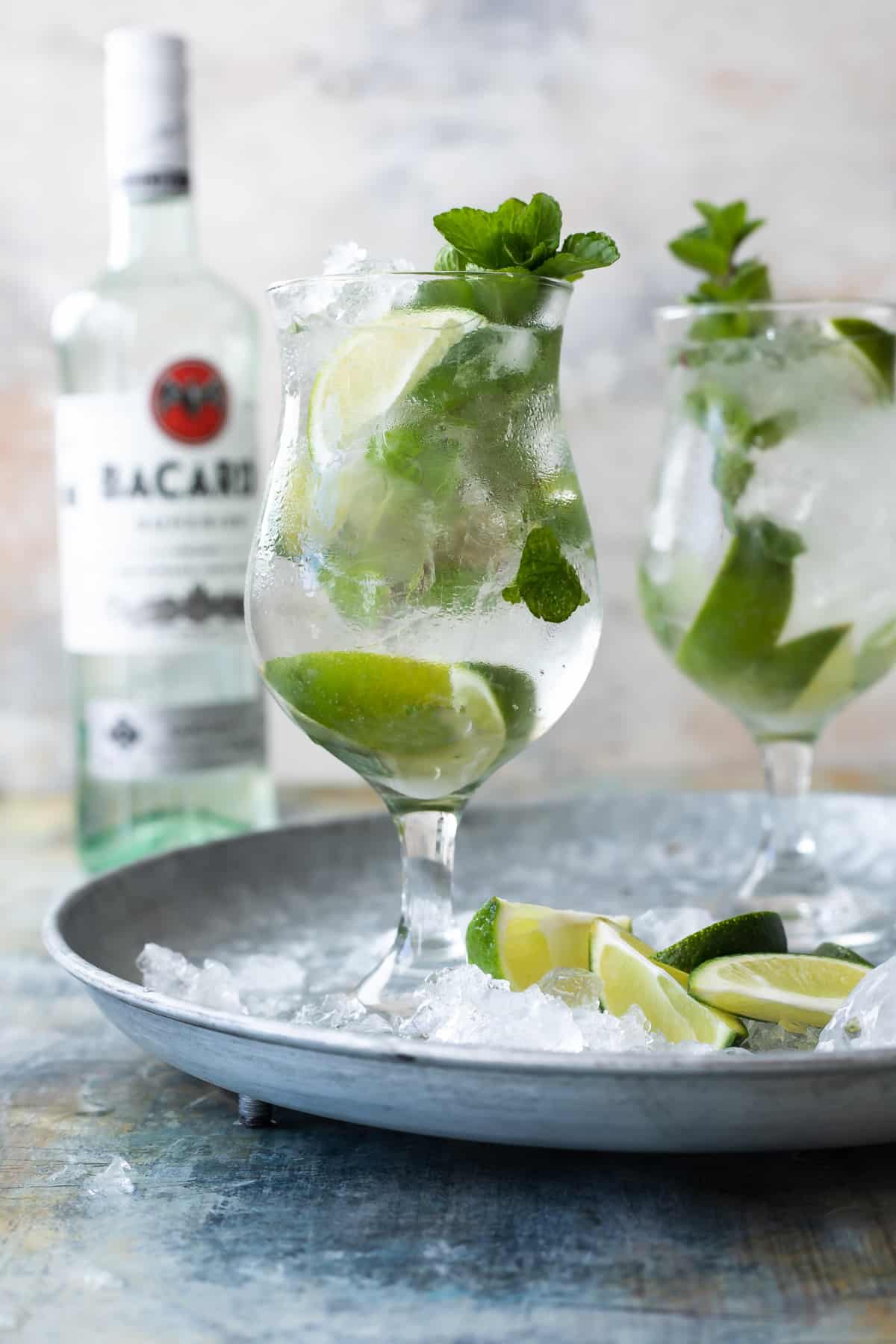 Two mojitos in glasses.