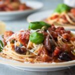 Plates of pasta puttanesca.