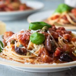 Plates of pasta puttanesca.