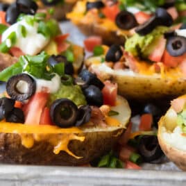 Potato skins on a baking sheet.