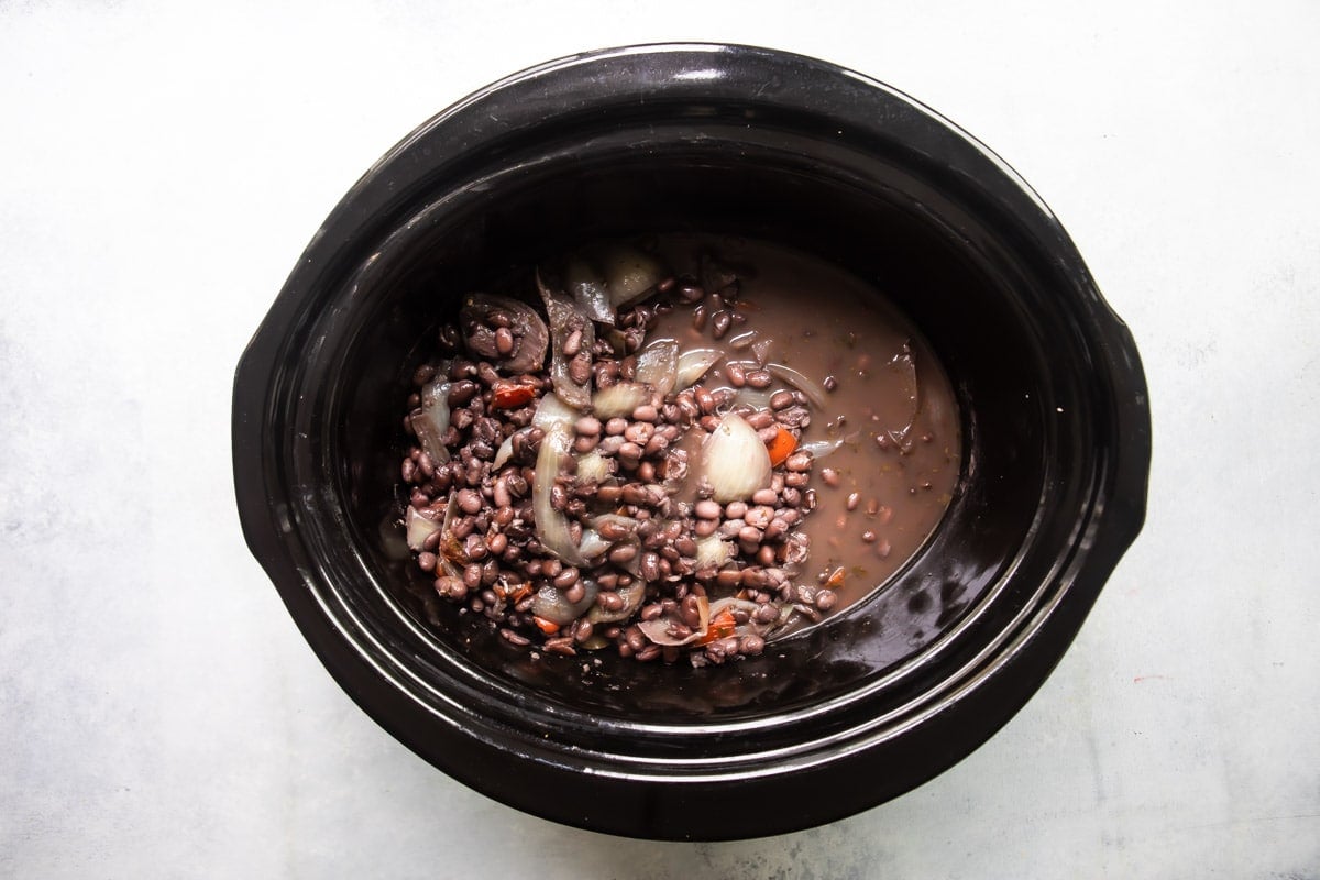Slow cooker black beans after being cooked in a crock pot.