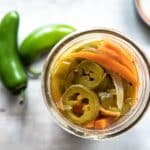A jar with pickled jalapeños.