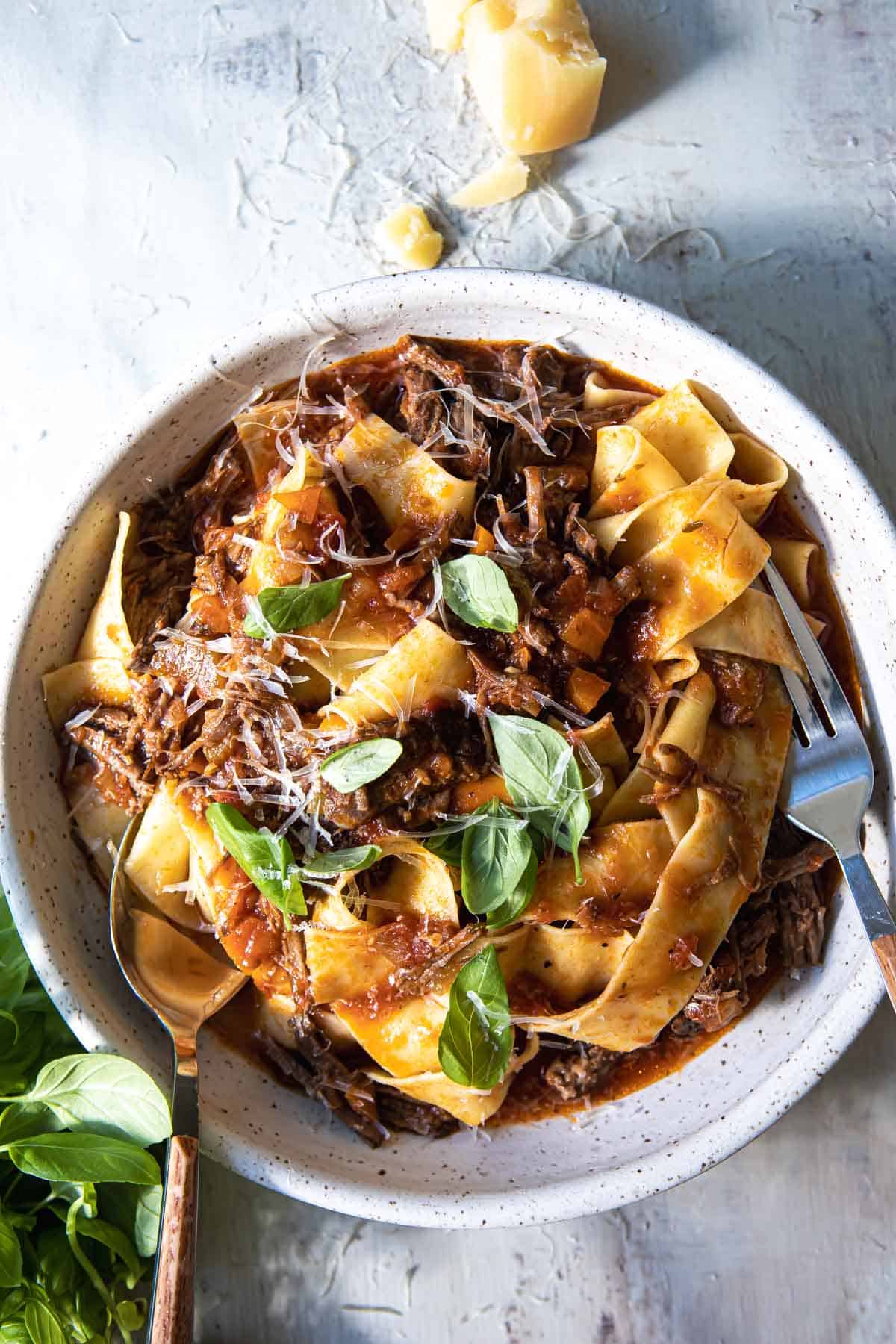 Beef ragu in a gray bowl.