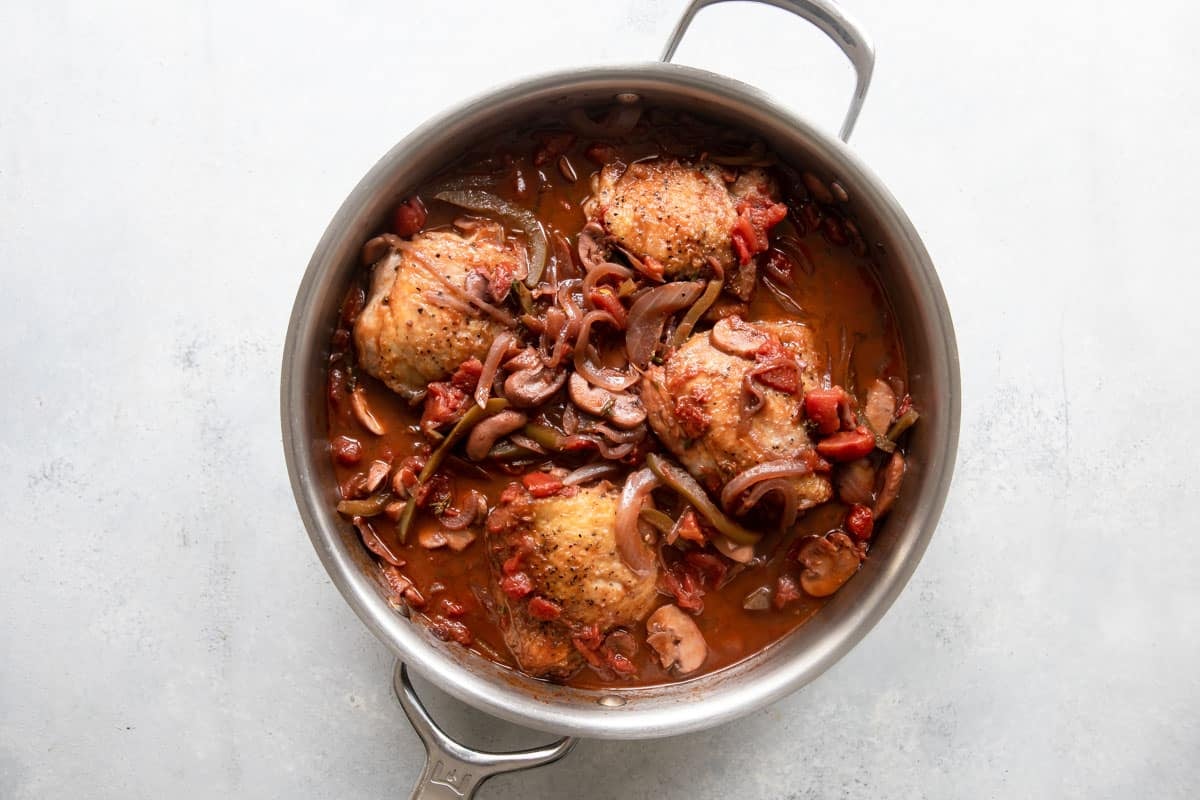 Chicken Cacciatore in a skillet before being garnished.