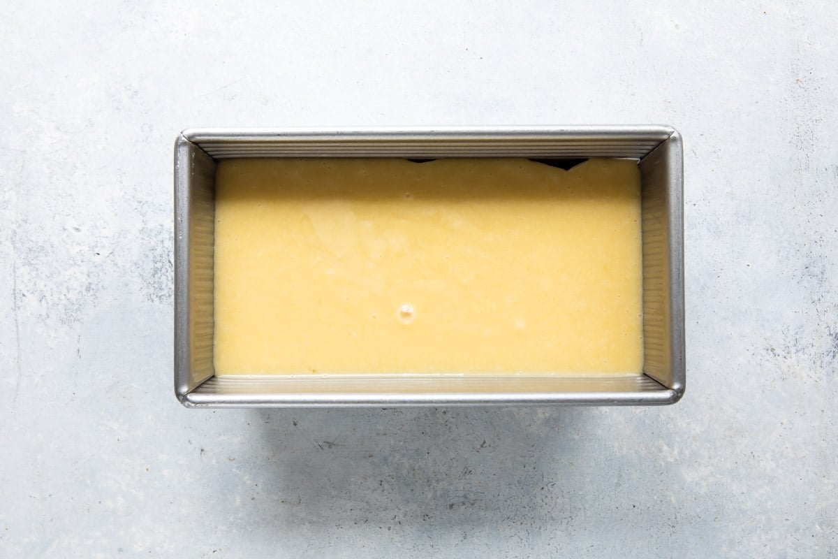 Coconut cake batter in a loaf pan.