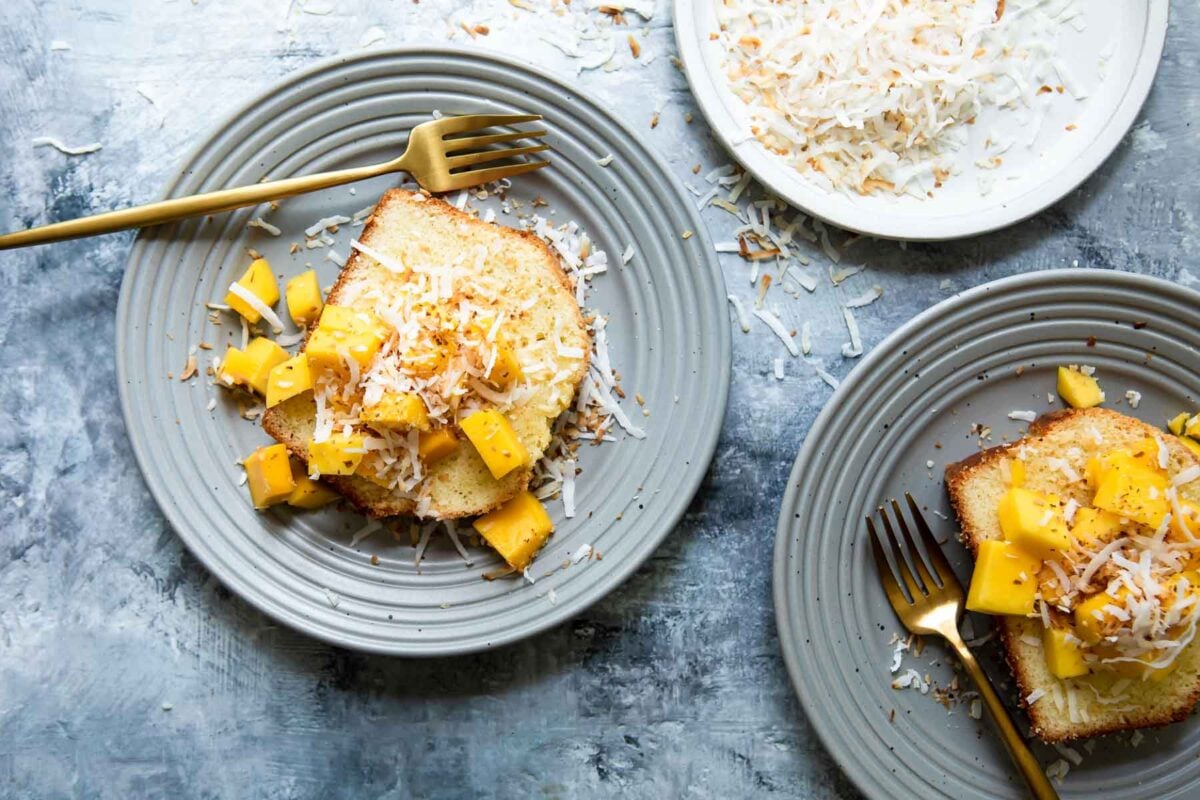 Coconut cake with mango cubes on top.