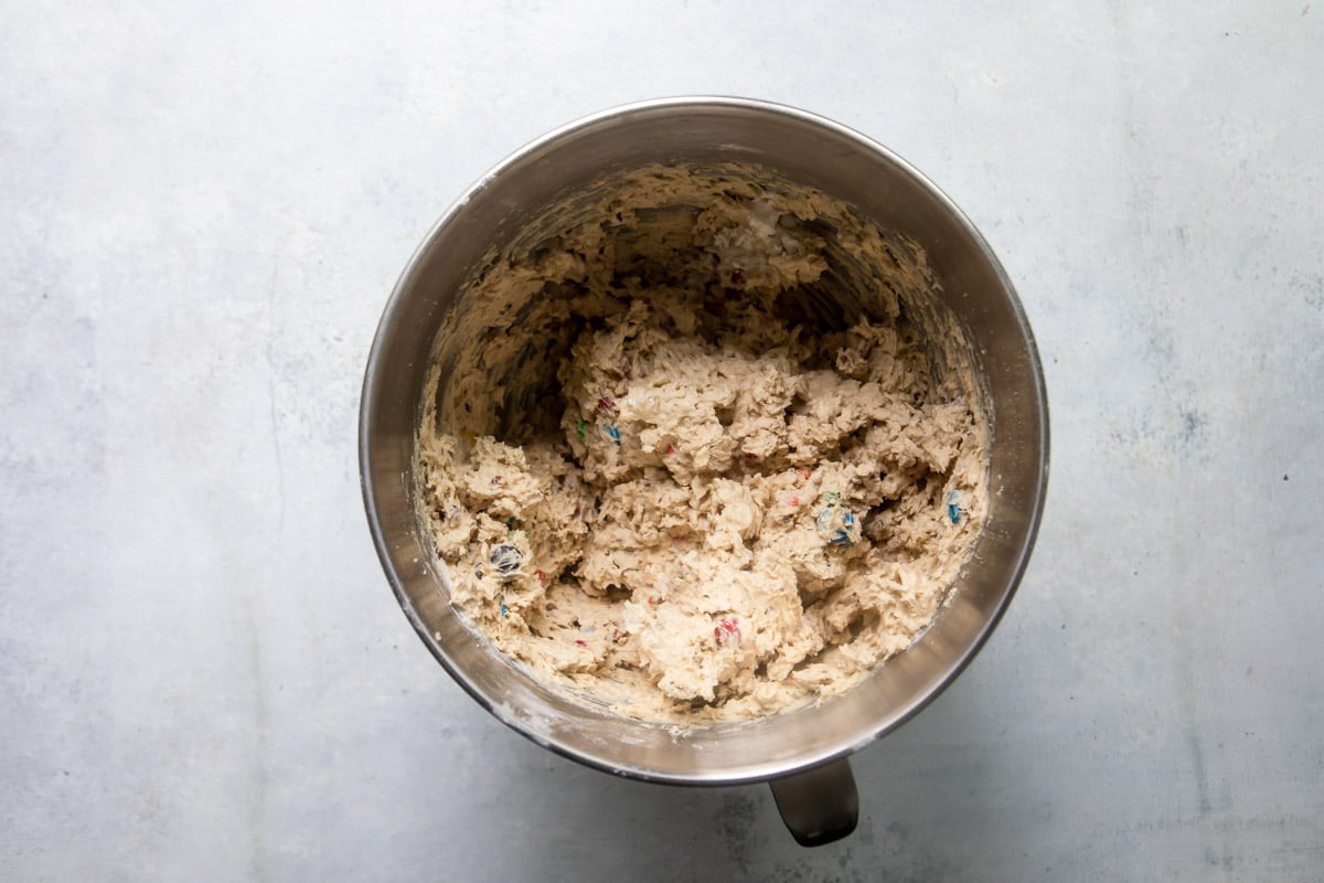 Dough for cowboy cookies in a mixing bowl.