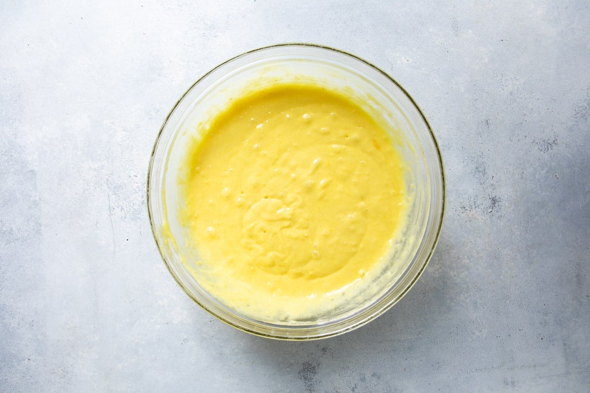 Bundt cake batter in a clear bowl.