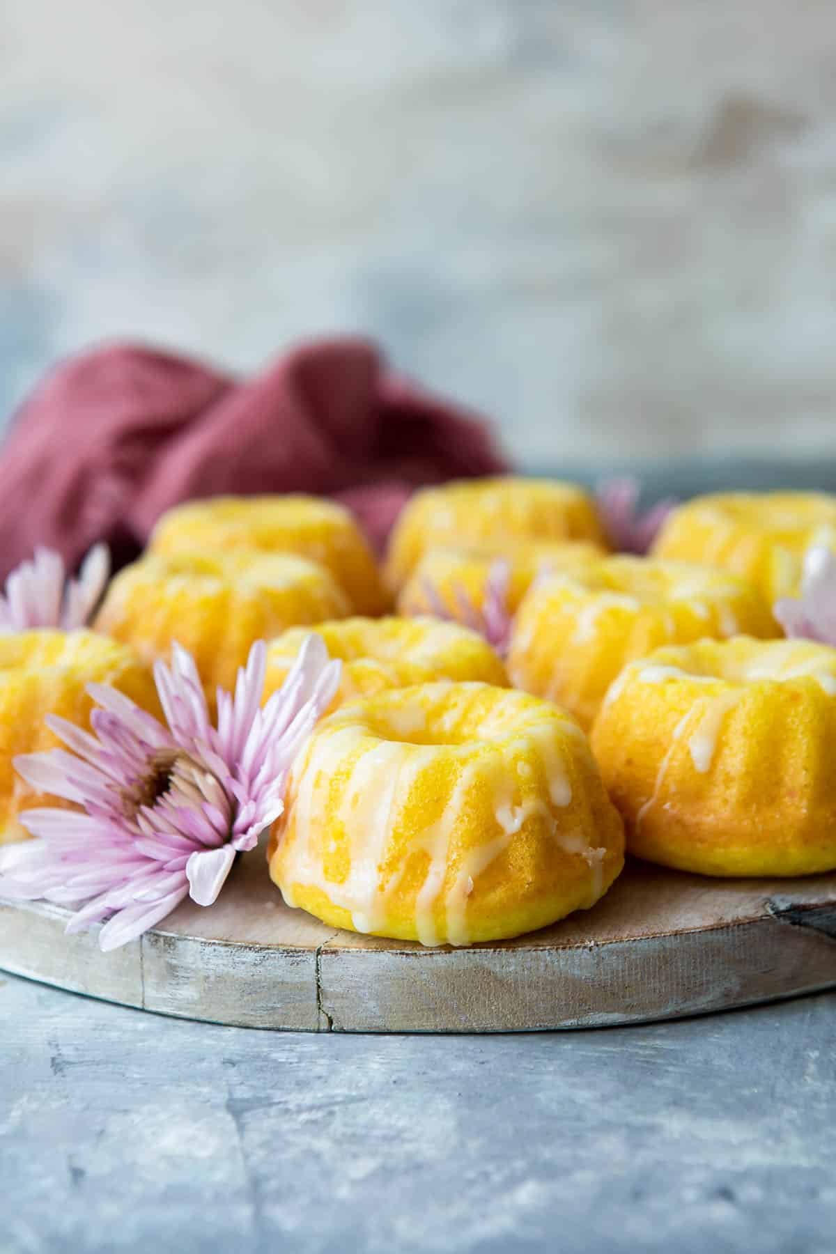 A wooden platter of mini bundt cakes.