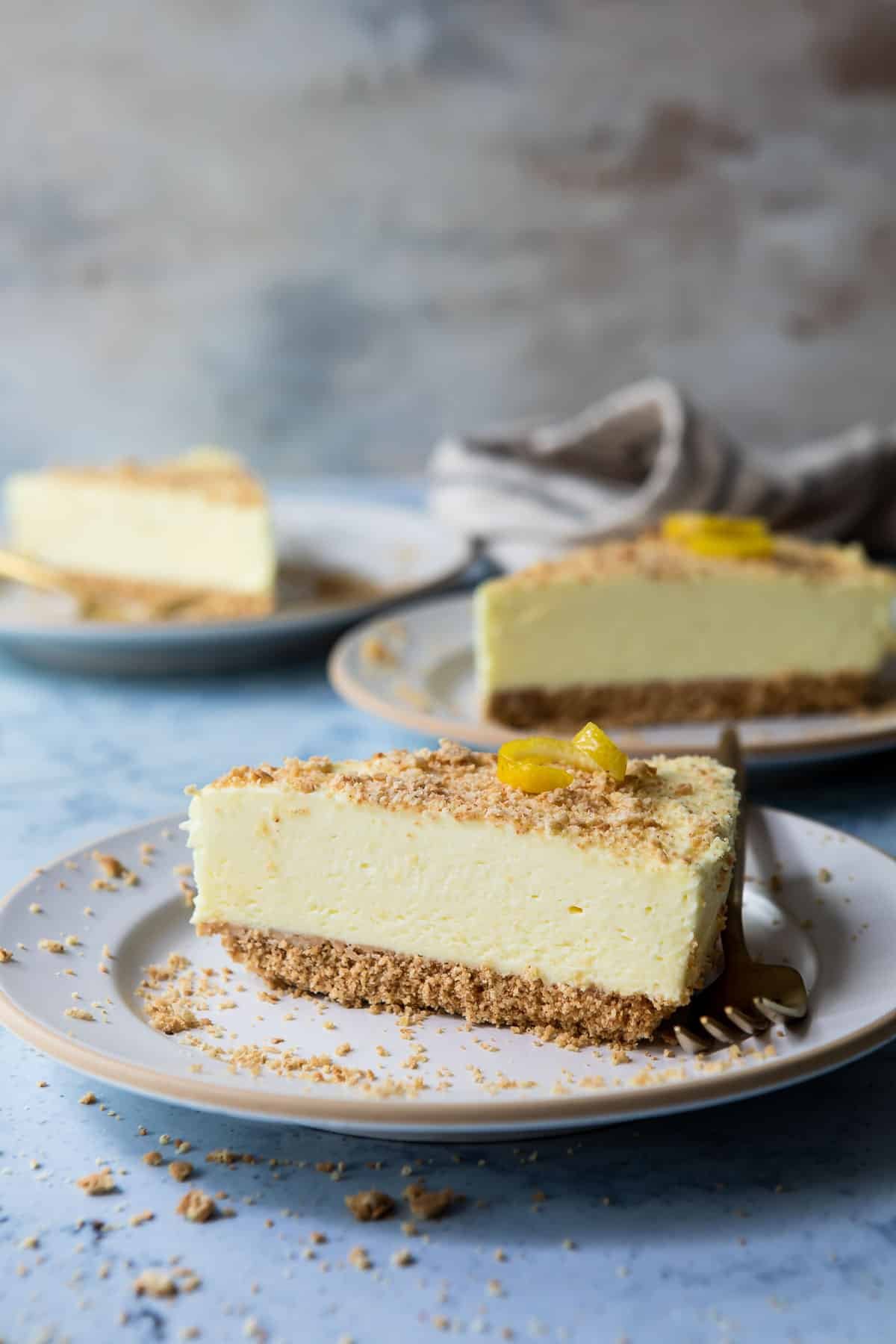 A slice of no bake lemon cheesecake on a small plate.