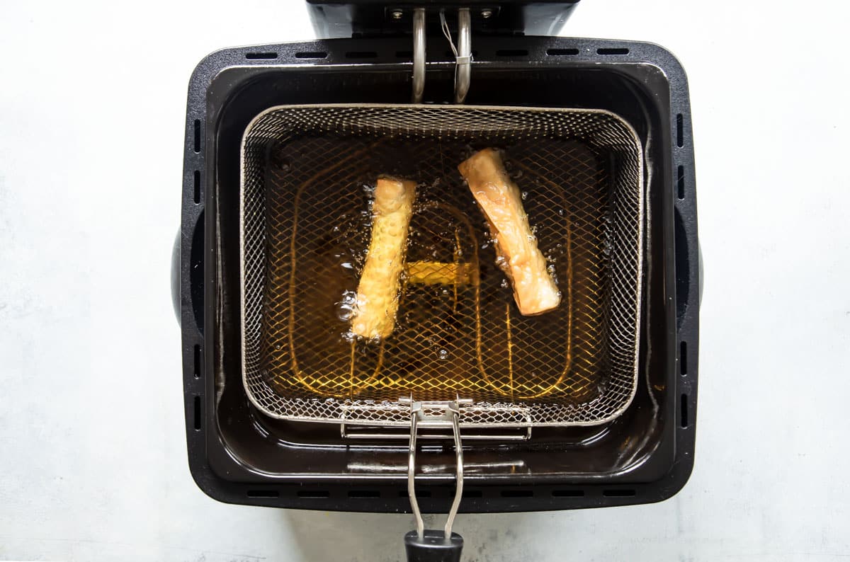 Pizza sticks in a countertop deep fryer.