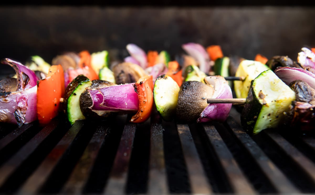 Veggie kabobs being grilled.