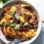 Beef ragu in a gray bowl.