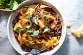 Beef ragu in a gray bowl.