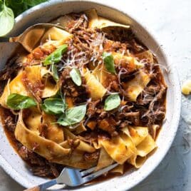 Beef ragu in a gray bowl.