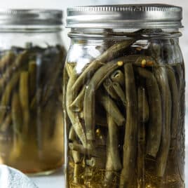 Two jars of pickled green beans.
